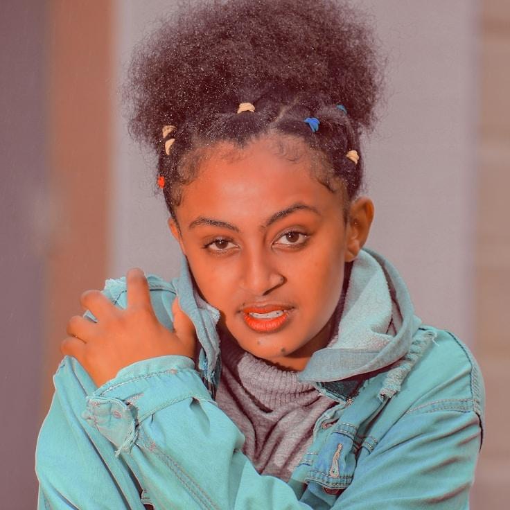 Alex Kim, Lead Design Curator at WorksVoyageMarket, reviewing corporate floral arrangements